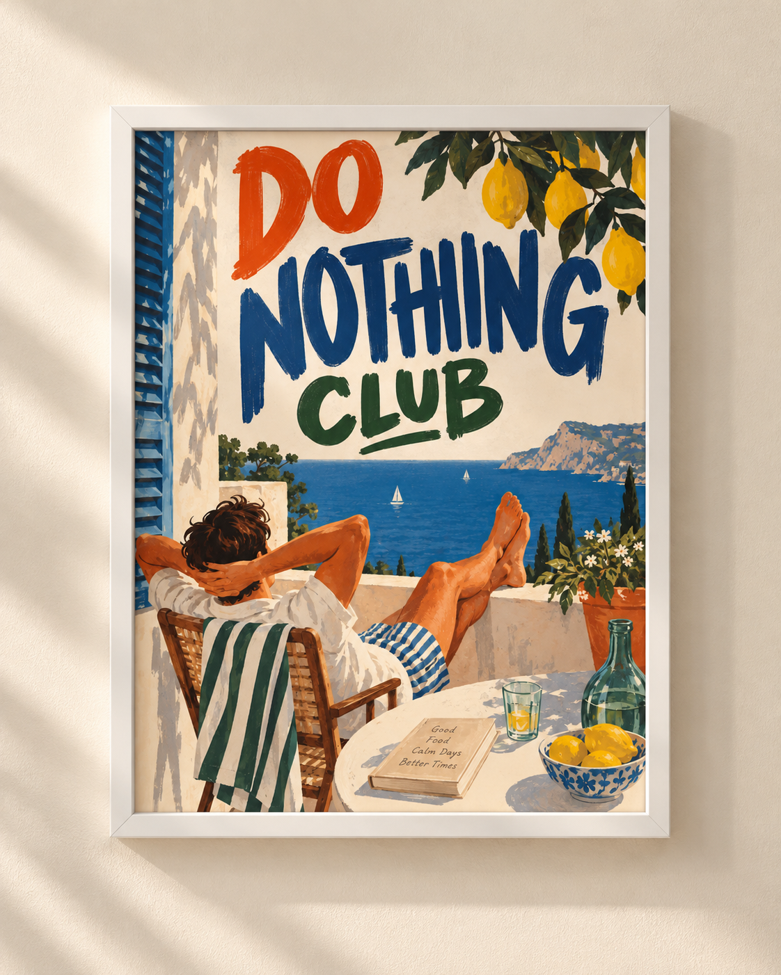 Plakat Do Nothing Club w białej ramie, z ilustracją śródziemnomorskiego tarasu nad morzem