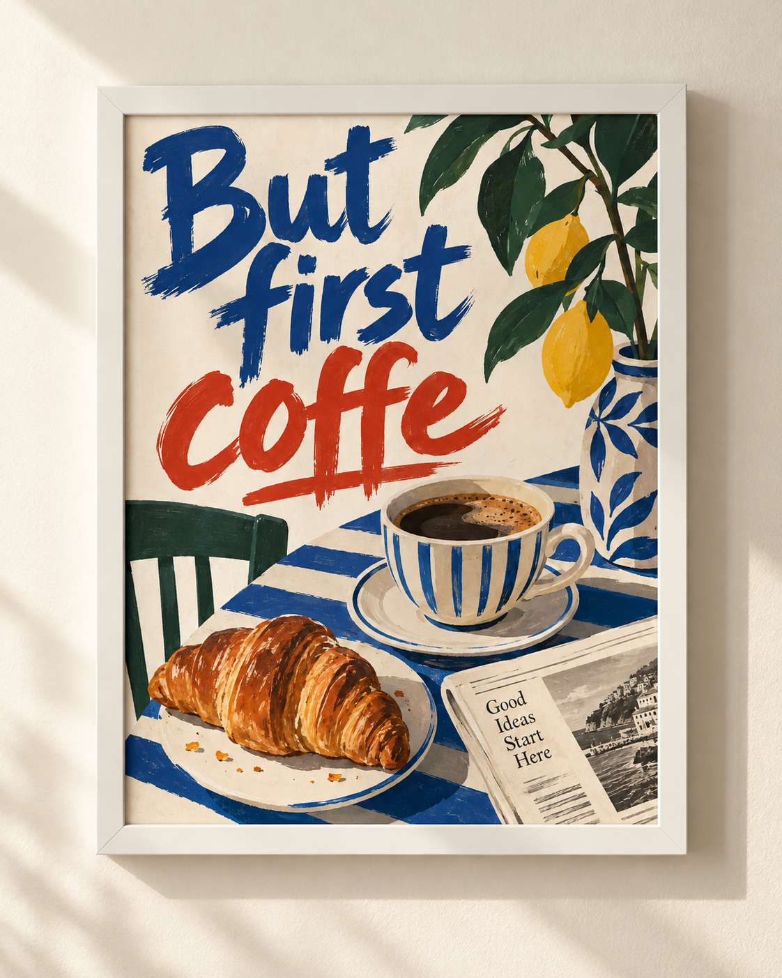 Plakat But First Coffee w białej ramie, przedstawiający kawę, croissanta i cytryny