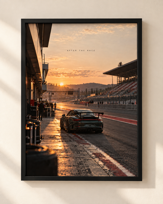 After The Race framed automotive poster by NEX, showing a sports car on a pit lane at sunset