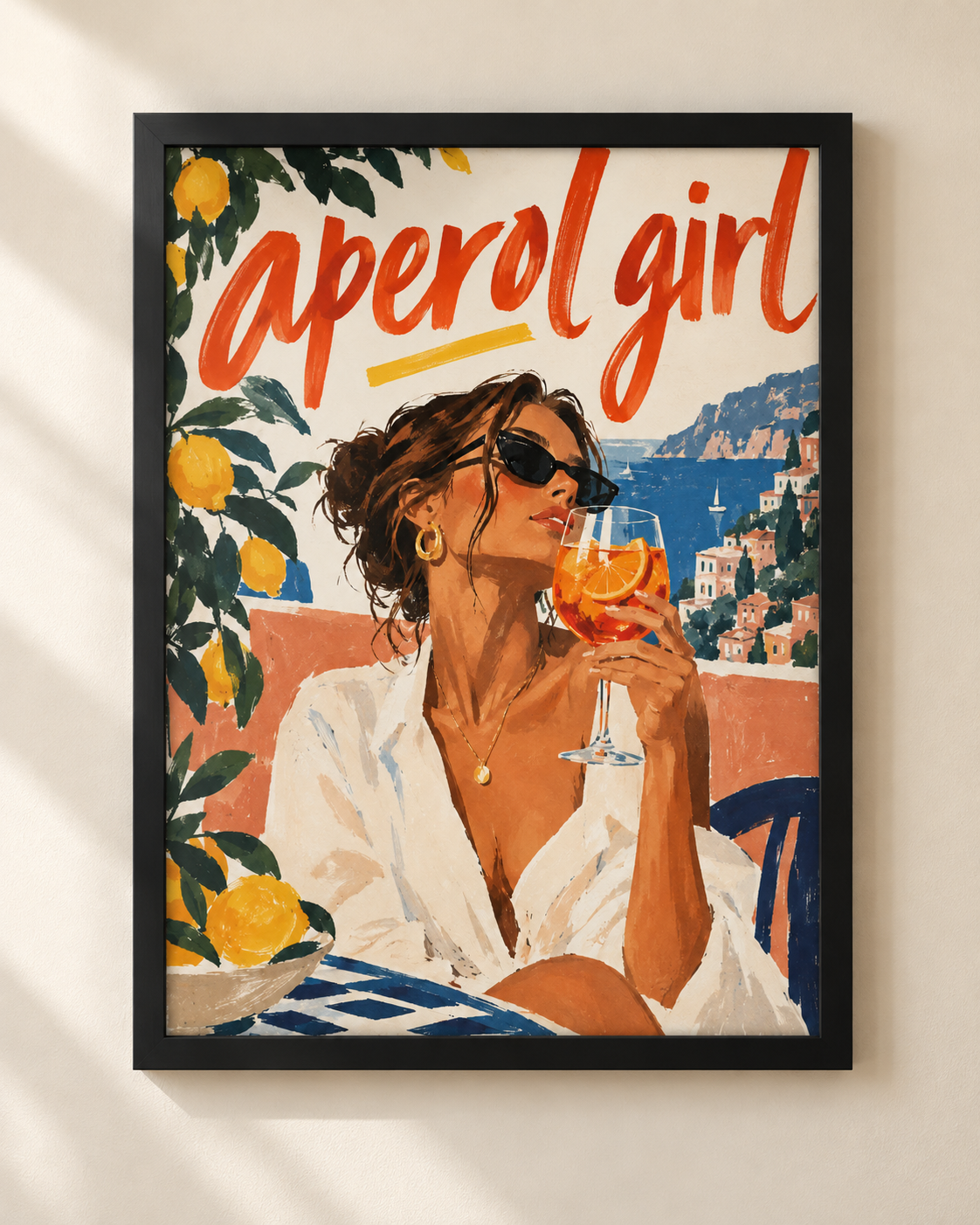 Aperol Girl Mediterranean lifestyle poster showing a woman with an orange aperitivo by the Italian coast in a black frame