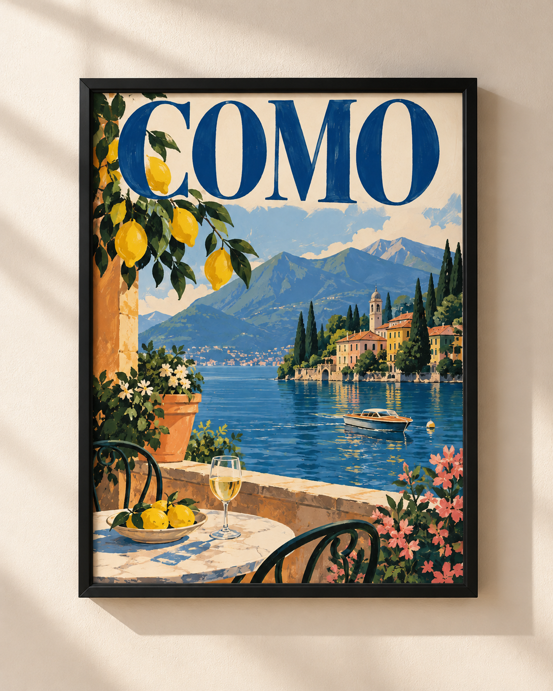 Como travel poster in a black wooden frame featuring Lake Como, blue lettering, lemon tree and Italian lakeside village
