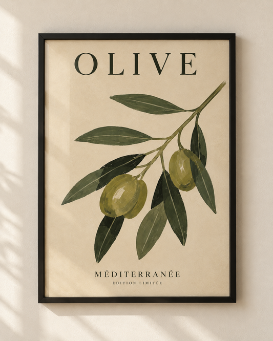 Olive botanical poster with an illustrated olive branch in a black wooden frame on a warm ivory wall.